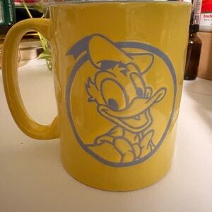 Disney Yellow Mug with Blue Donald Duck Design